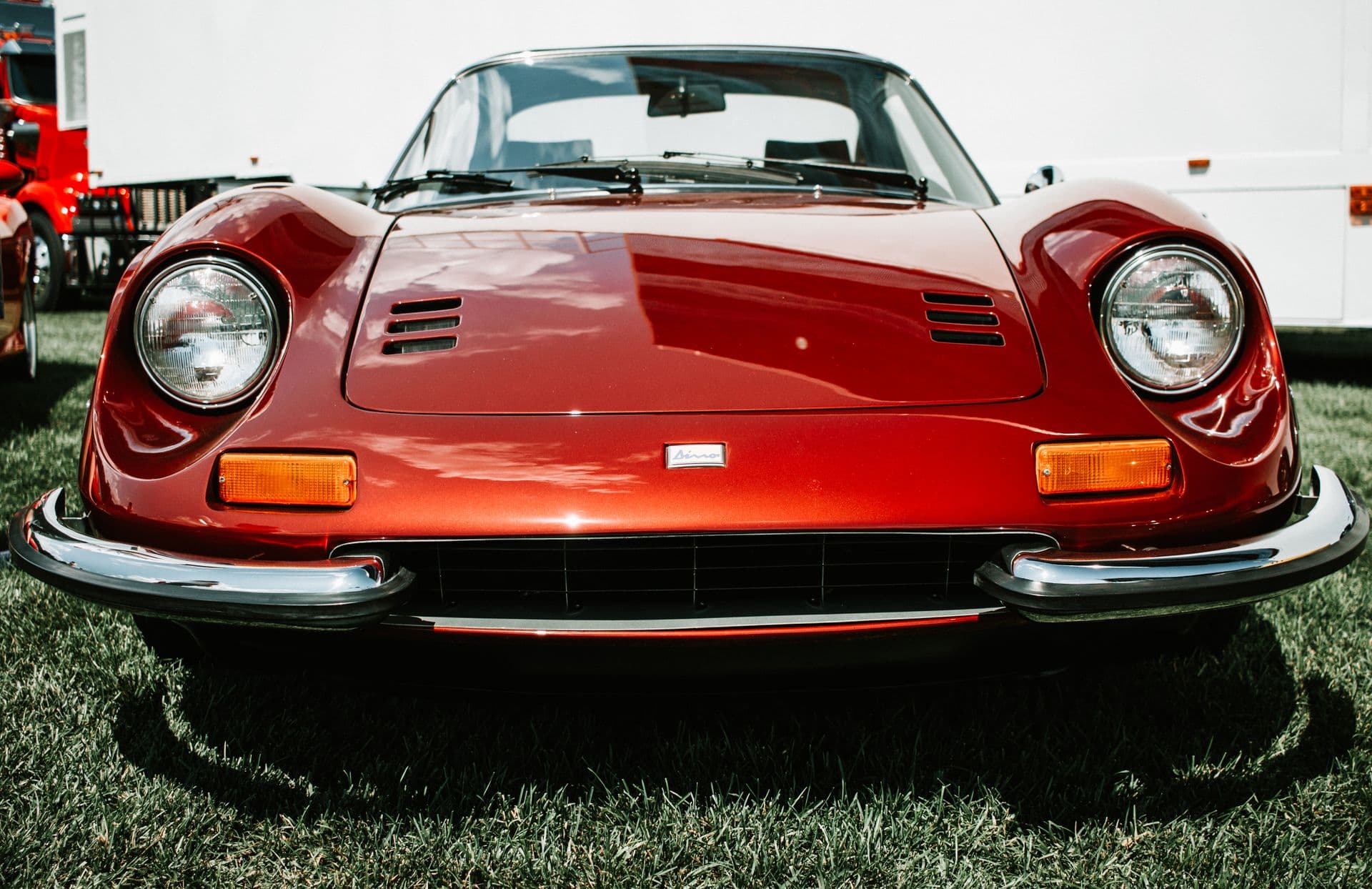 A red Ferrari Dino photographed head-on